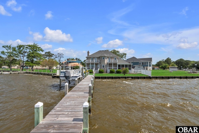 view of dock featuring boat lift and a water view