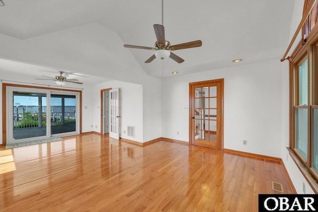 unfurnished room with visible vents, ceiling fan, and vaulted ceiling