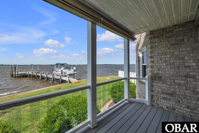 deck with a water view and a dock