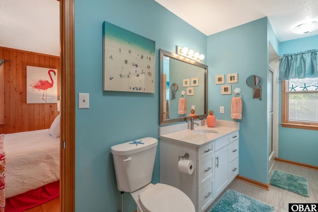 50011 Kings Point Dr Lot 335, Frisco, NC 27936 - bathroom featuring wooden walls, an enclosed shower, toilet, and vanity