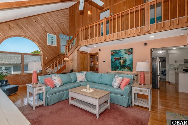 50011 Kings Point Dr Lot 335, Frisco, NC 27936 - living area featuring wood finished floors, wood walls, and high vaulted ceiling