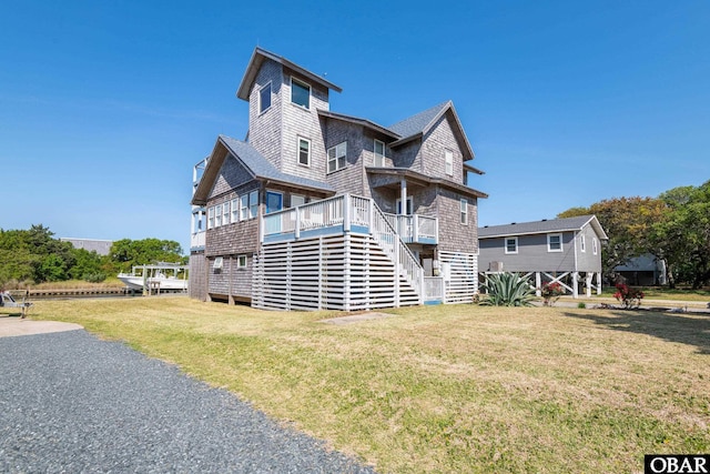 50011 Kings Point Dr Lot 335, Frisco, NC 27936 - back of property featuring a lawn and stairway
