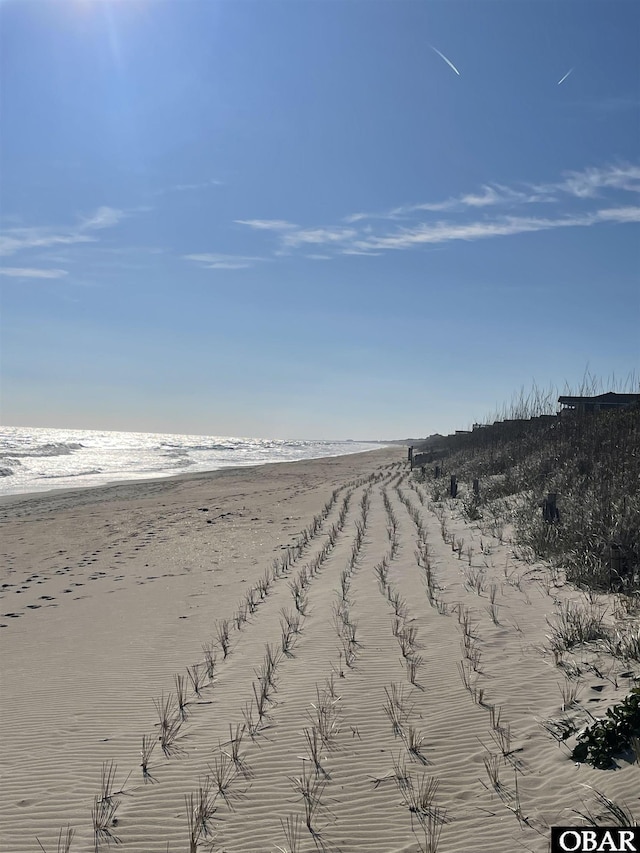 view of water feature with a beach view