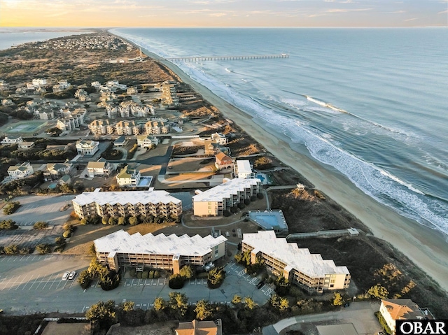 aerial view featuring a view of the beach and a water view