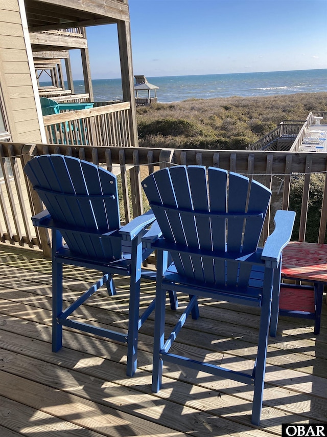 exterior space with a beach view and a water view