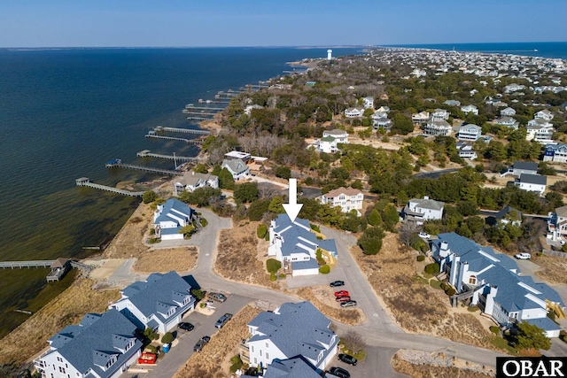 bird's eye view featuring a residential view and a water view