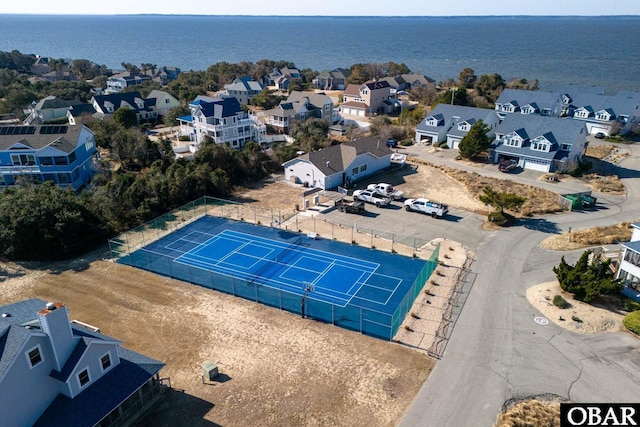 birds eye view of property with a residential view and a water view