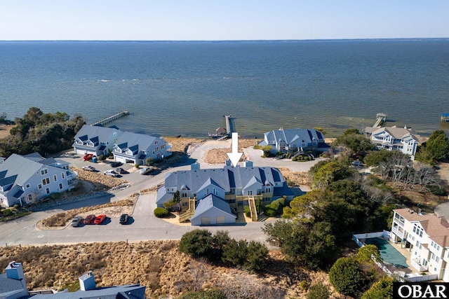 aerial view with a water view and a residential view