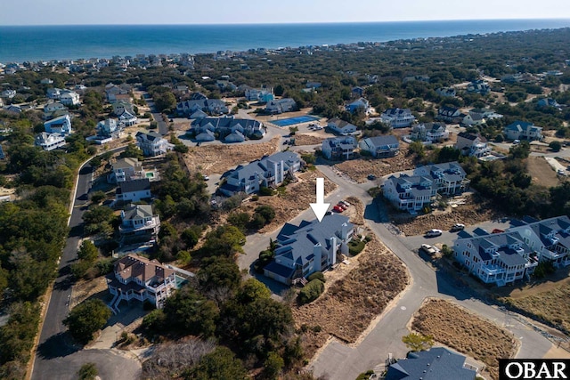 bird's eye view featuring a residential view and a water view