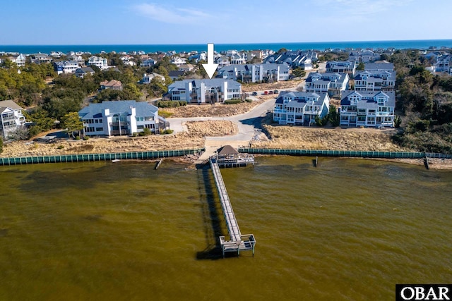 bird's eye view with a water view and a residential view