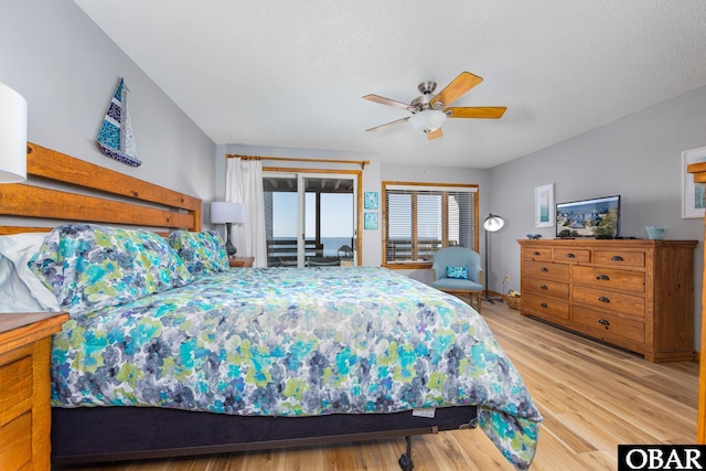 bedroom with access to exterior, ceiling fan, and light wood finished floors