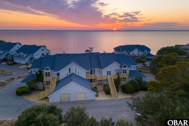 aerial view at dusk with a water view