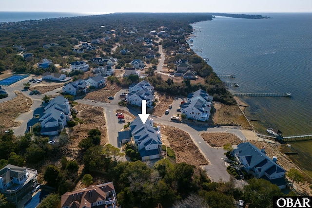 birds eye view of property featuring a water view and a residential view