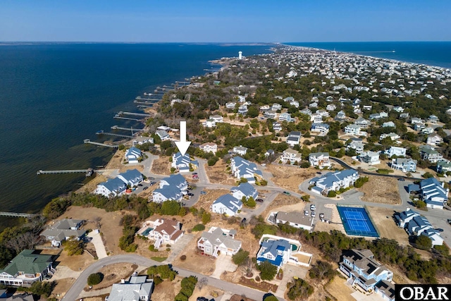 birds eye view of property with a water view and a residential view