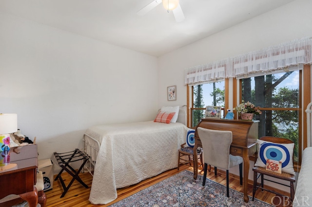 bedroom featuring a ceiling fan and wood finished floors