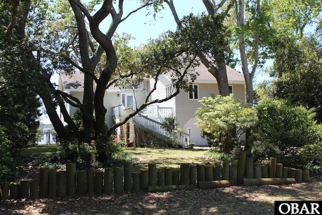 exterior space featuring stairs and fence