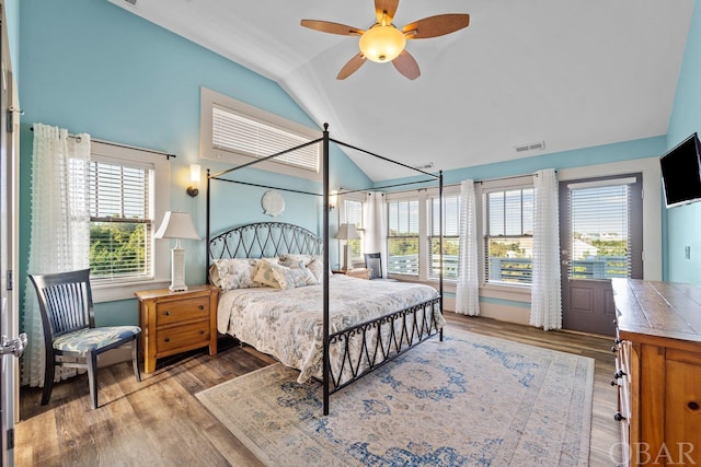 bedroom with vaulted ceiling, ceiling fan, light wood-type flooring, and visible vents