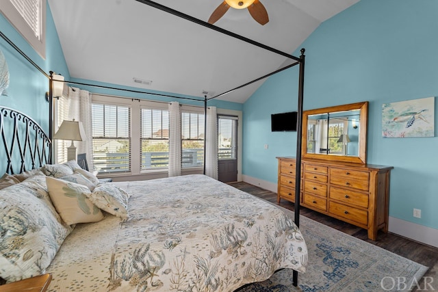 bedroom featuring high vaulted ceiling, dark wood finished floors, visible vents, and baseboards