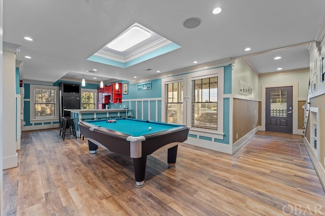 game room featuring recessed lighting, ornamental molding, wood finished floors, and wainscoting