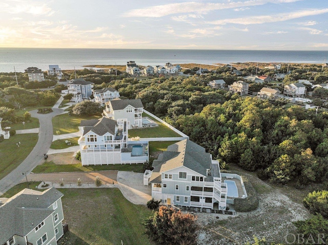 aerial view at dusk with a water view