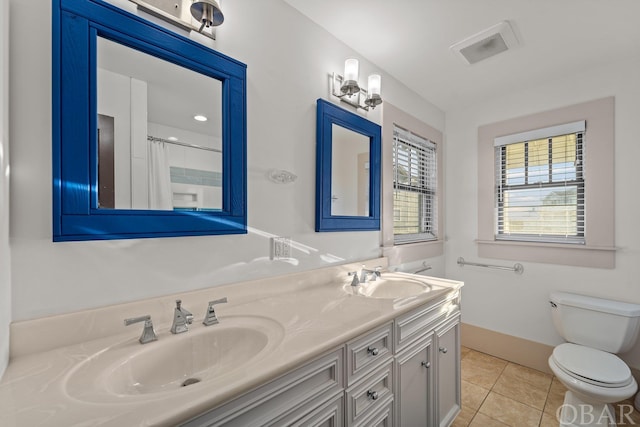 bathroom with visible vents, tile patterned flooring, a sink, and toilet