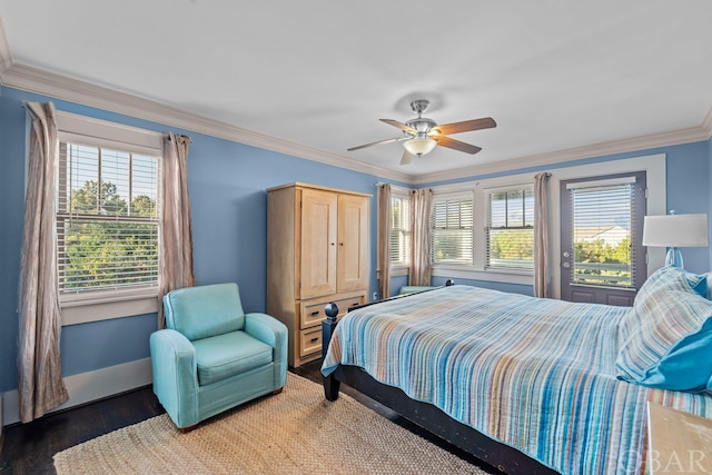 bedroom featuring baseboards, ceiling fan, dark wood-type flooring, and crown molding