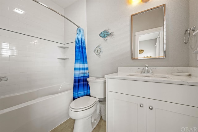 full bathroom featuring a textured wall, toilet, shower / tub combo with curtain, tile patterned floors, and vanity