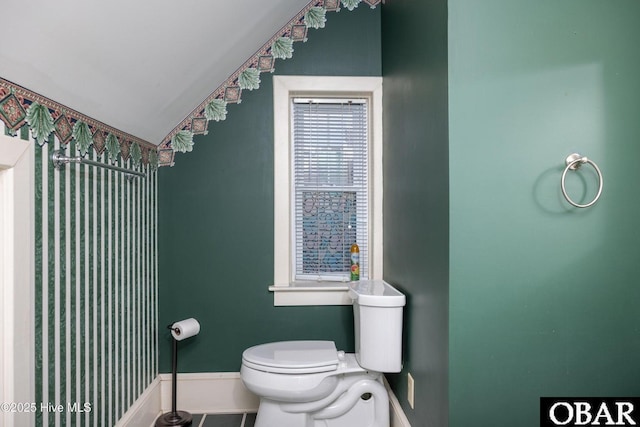 505 N Broad St, Edenton, NC 27932 - bathroom featuring toilet, baseboards, and lofted ceiling