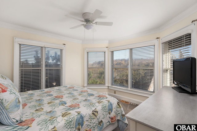 bedroom featuring crown molding, multiple windows, and a ceiling fan