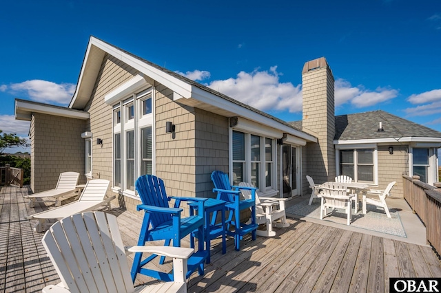 wooden deck with outdoor dining space