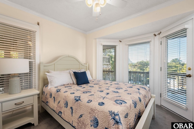 bedroom with a ceiling fan, a textured ceiling, crown molding, access to outside, and dark colored carpet