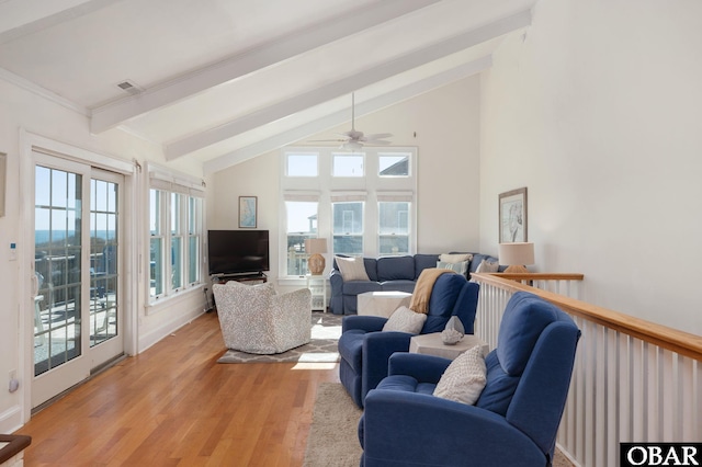 living area featuring beamed ceiling, light wood-style floors, ceiling fan, and high vaulted ceiling