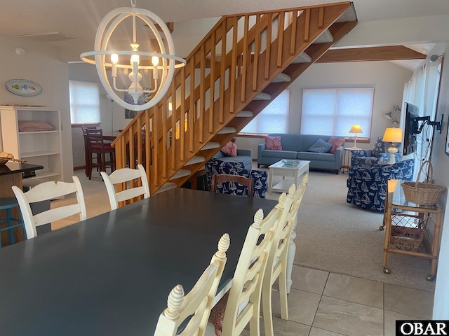 58221 Liberator Way Lot 1-3, Hatteras, NC 27943 - dining space with stairs, carpet floors, and a chandelier