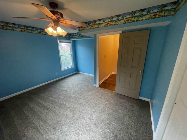 unfurnished bedroom featuring baseboards, a ceiling fan, and carpet flooring