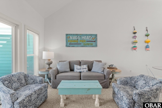 1107 Cambridge Rd Unit 305-F, Kill Devil Hills, NC 27948 - carpeted living room featuring vaulted ceiling