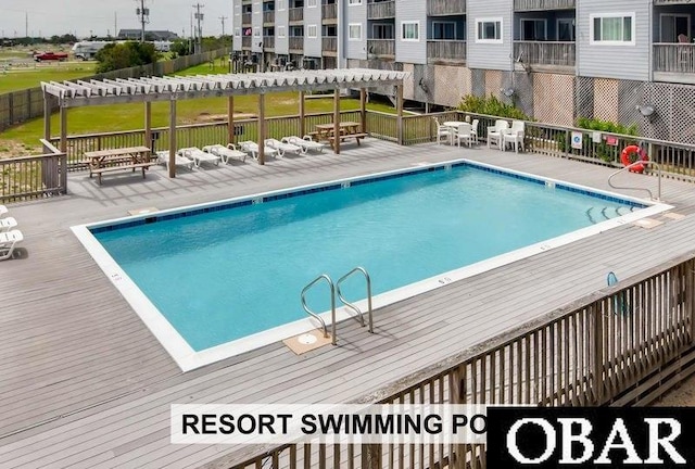 24250 Resort Rodanthe Dr Unit 12B, Rodanthe, NC 27968 - community pool with a pergola and a deck