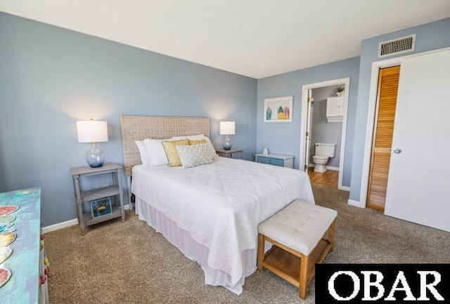 24250 Resort Rodanthe Dr Unit 12B, Rodanthe, NC 27968 - carpeted bedroom featuring connected bathroom and baseboards