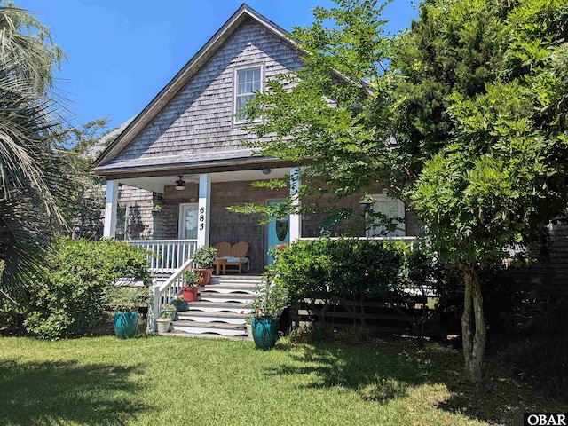 671 Irvin Garrish Hwy Lot # 1, Ocracoke, NC 27960 - view of front facade featuring covered porch, a front yard, and a ceiling fan