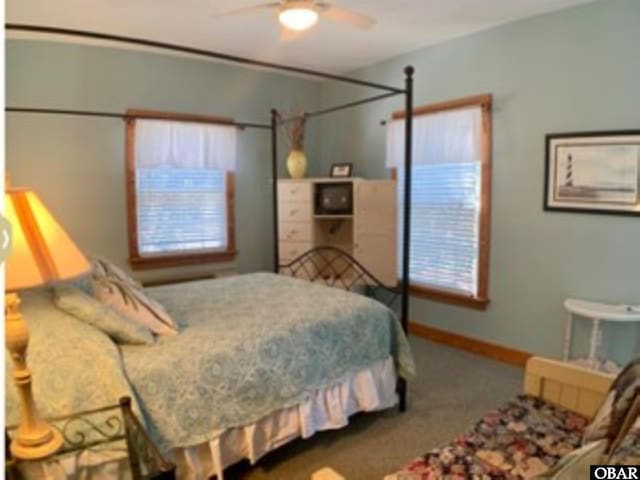 671 Irvin Garrish Hwy Lot # 1, Ocracoke, NC 27960 - bedroom featuring carpet flooring, a ceiling fan, and baseboards