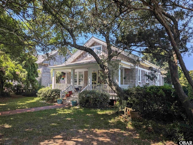671 Irvin Garrish Hwy Lot # 1, Ocracoke, NC 27960 - view of front facade with covered porch and a front yard