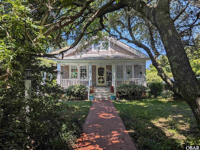 671 Irvin Garrish Hwy Lot # 1, Ocracoke, NC 27960 - bungalow featuring a porch