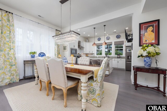 504 Lord Essex Ave, Manteo, NC 27954 - dining space featuring visible vents, recessed lighting, dark wood finished floors, and a chandelier