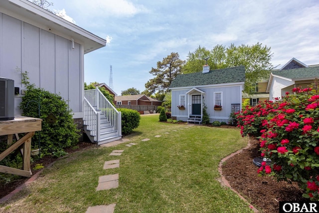 504 Lord Essex Ave, Manteo, NC 27954 - view of yard featuring an outdoor structure and central air condition unit
