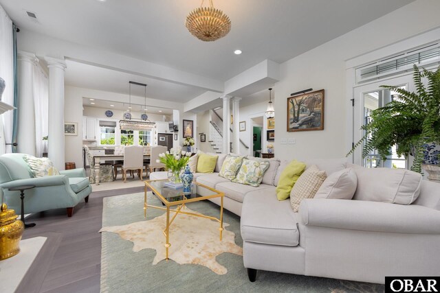 504 Lord Essex Ave, Manteo, NC 27954 - living room with visible vents, stairs, decorative columns, wood finished floors, and recessed lighting