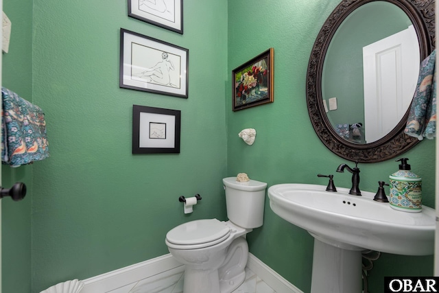 504 Lord Essex Ave, Manteo, NC 27954 - bathroom with baseboards, toilet, and marble finish floor