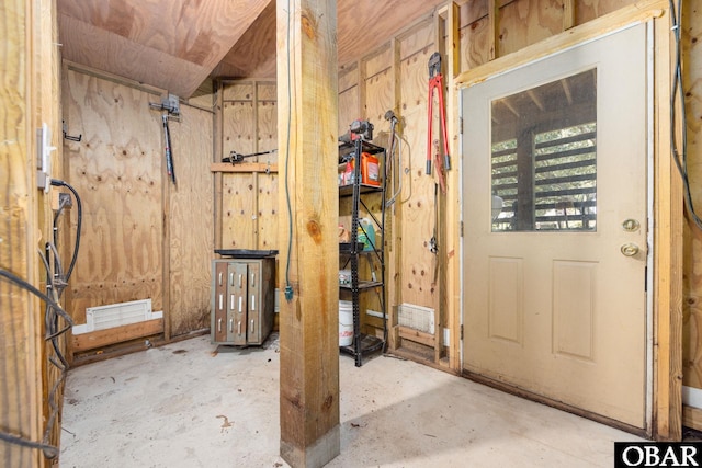 interior space featuring visible vents and concrete flooring