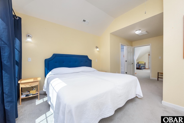 carpeted bedroom with vaulted ceiling, baseboards, and visible vents