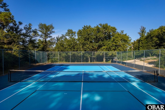 view of sport court with fence