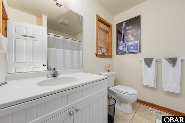 bathroom with visible vents, toilet, tile patterned flooring, baseboards, and vanity