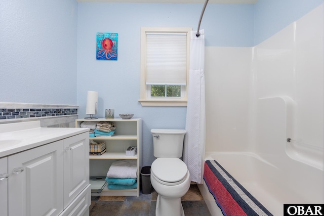 bathroom with toilet, shower / bath combo, and vanity